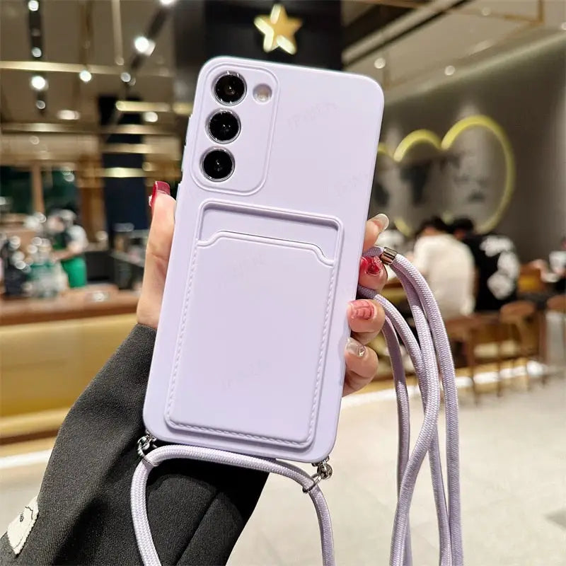 a woman holding a purple phone case