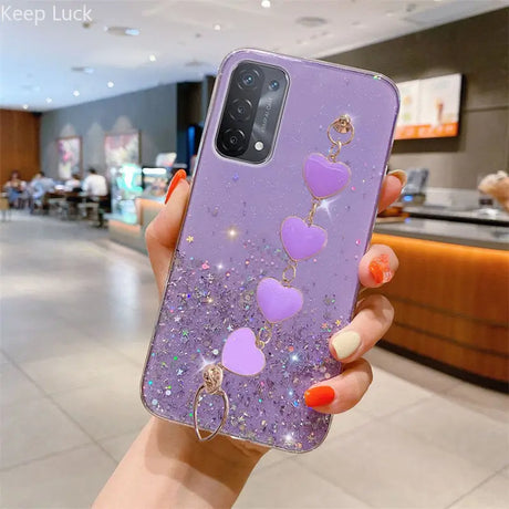 a woman holding a purple phone case with heart shaped balloons