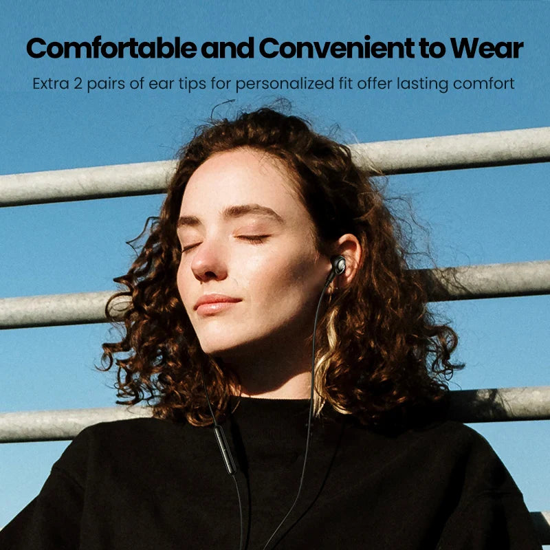 Woman wearing in-ear headphones.