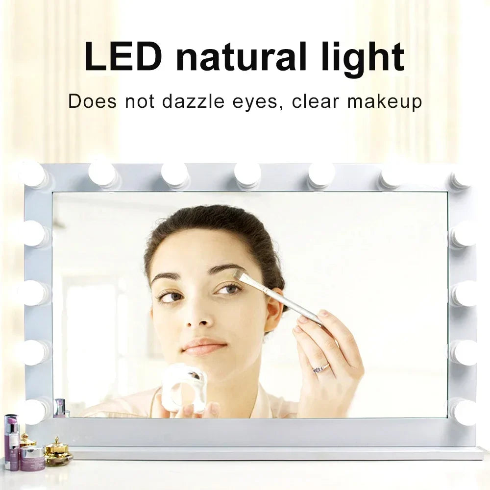 a woman is looking at her makeup in the mirror
