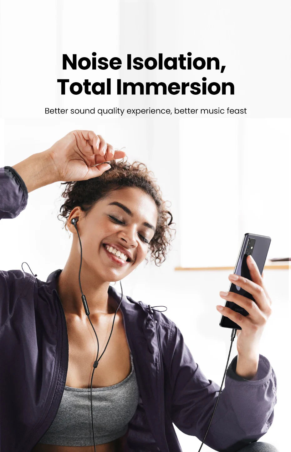 Woman listening to music with wired earphones.
