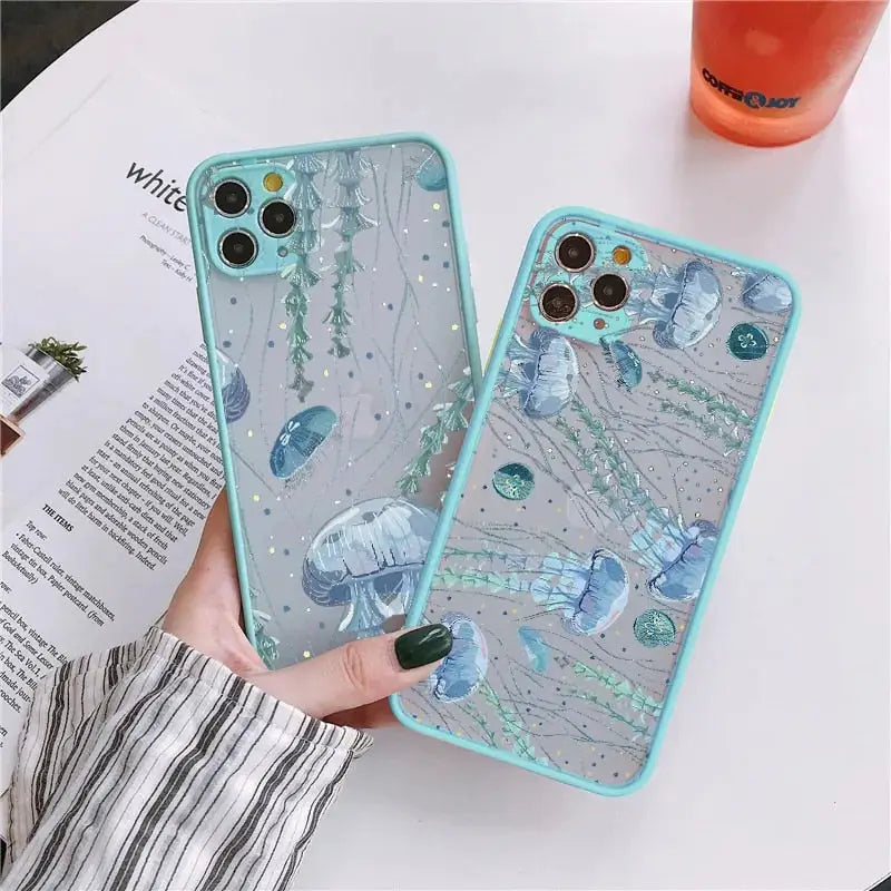 A woman holding a phone case with a blue flower design