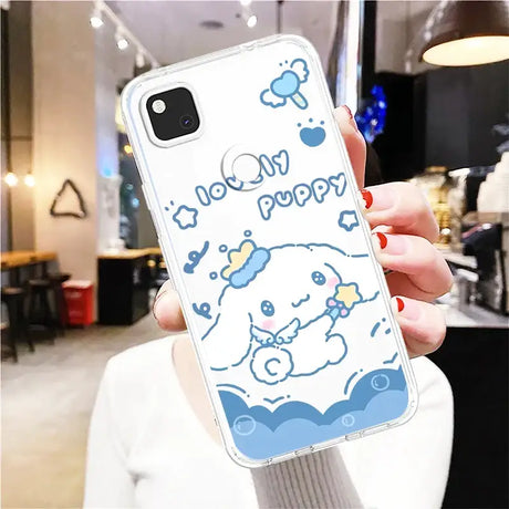 A woman holding up a phone case with a cartoon character