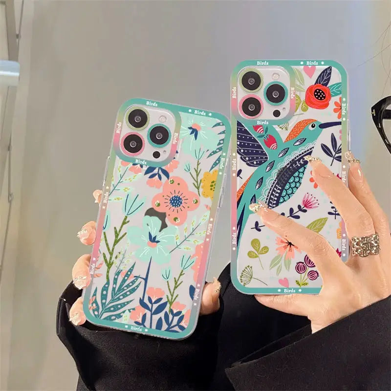 A woman holding a phone case with a floral pattern
