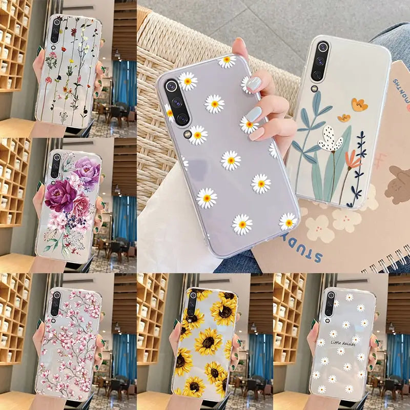A woman holding a phone case with flowers on it