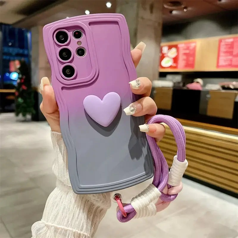 A woman holding up a purple phone case