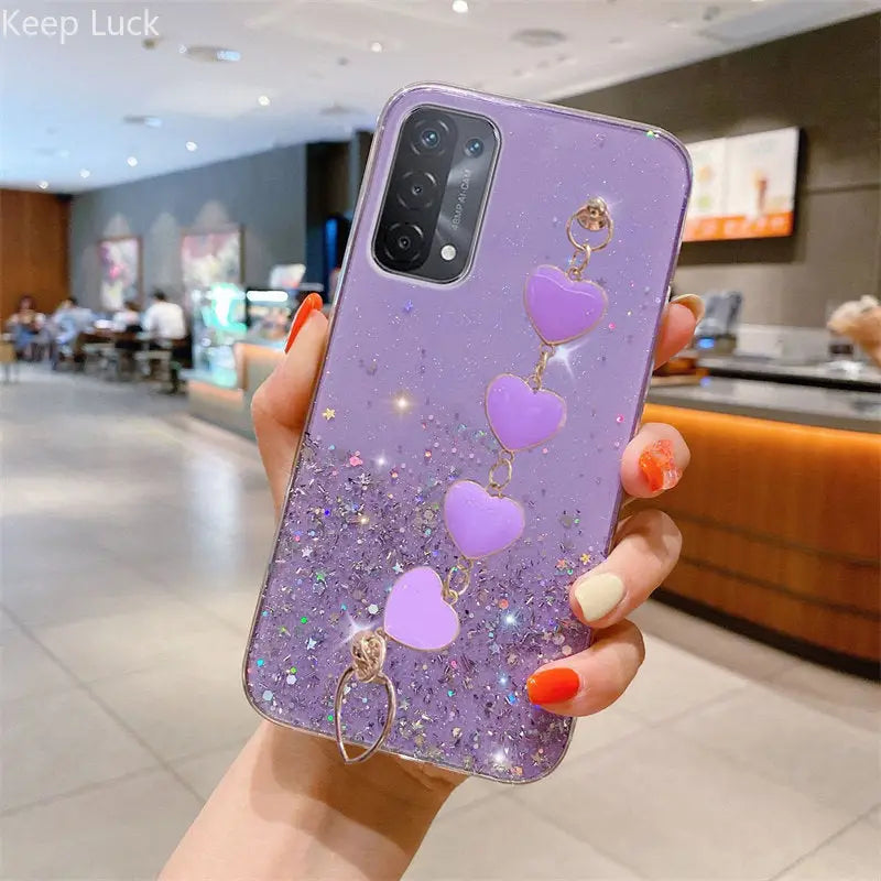a woman holding a purple phone case with heart shaped balloons