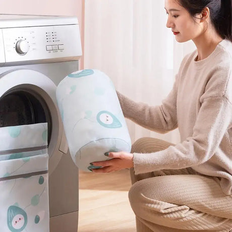 a woman is putting a laundry machine into the washing machine
