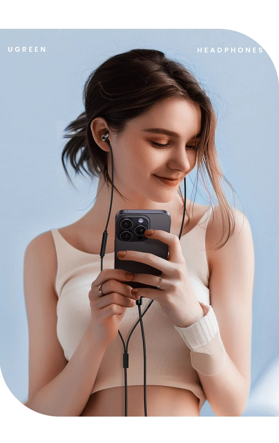 Woman using a smartphone while wearing earphones.