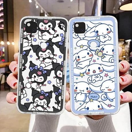 a woman holding two iphone cases with cartoon characters on them