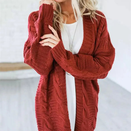 a woman wearing a red cardigan sweater