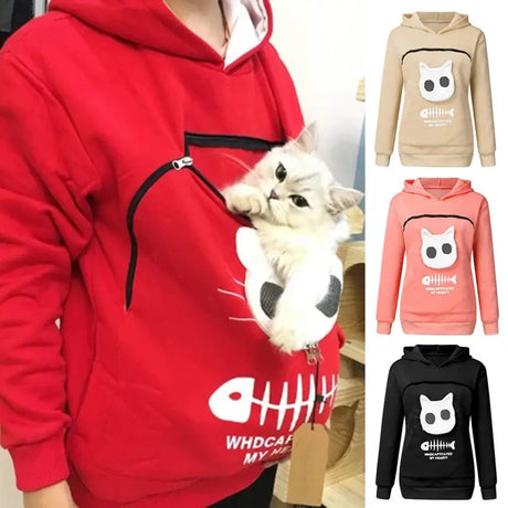 a woman wearing a red hoodie with a cat on it
