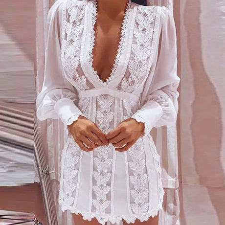 a woman wearing a white robe with lace detailing