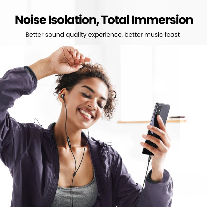 Woman using wired earphones with smartphone.