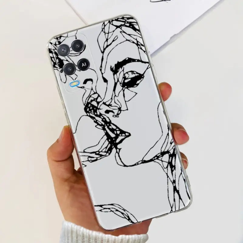 a woman’s face is drawn on a white phone case