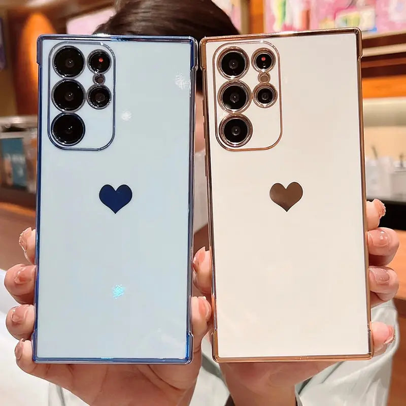 two women holding up their new iphones