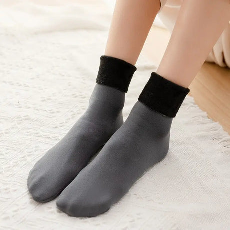 a woman wearing black socks with a white background