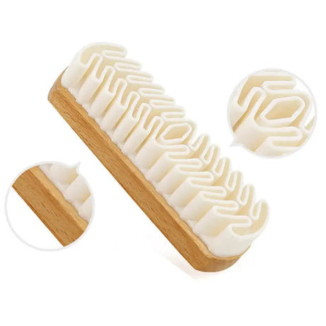 a wooden comb with a white comb on top