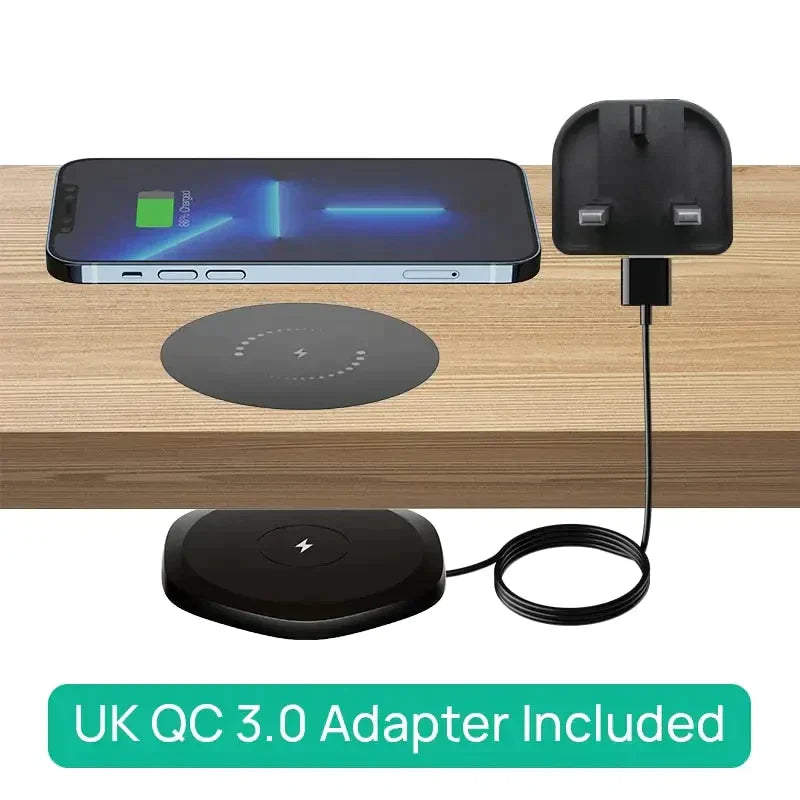 a wooden table with a charging station and a phone
