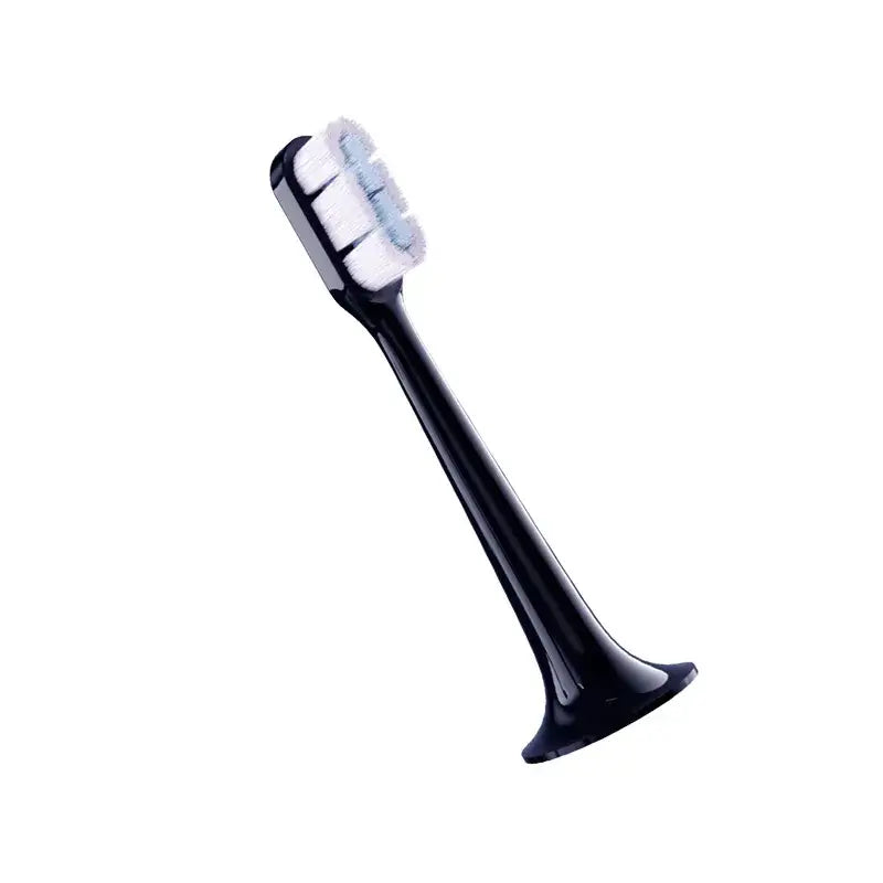 a black and white toothbrush with a white handle