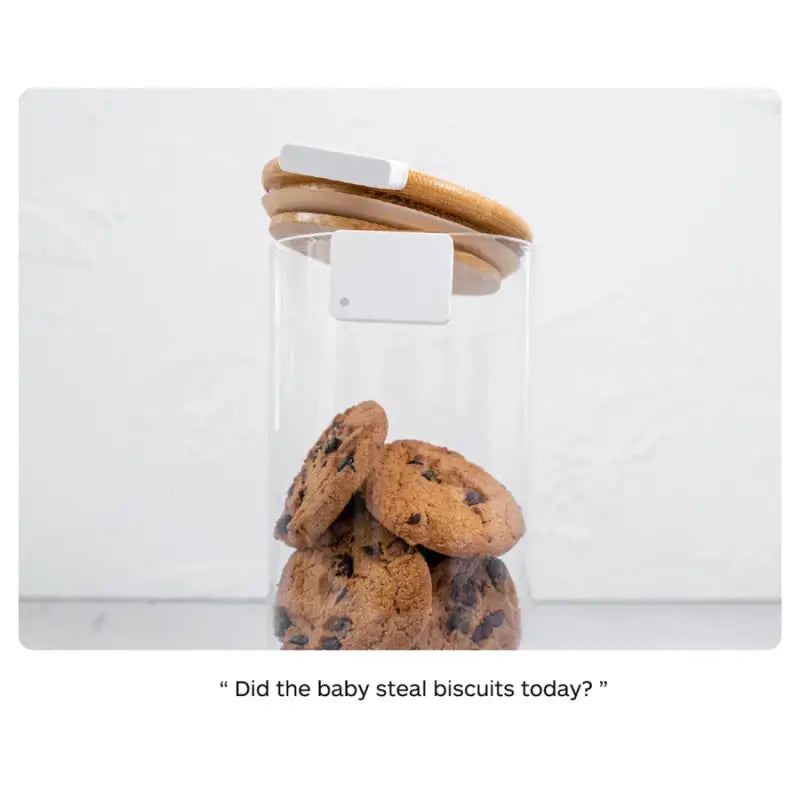 a cookie in a glass jar with a cookie inside