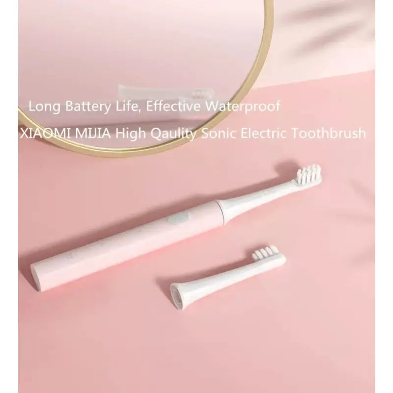 a white toothbrush and a pink background