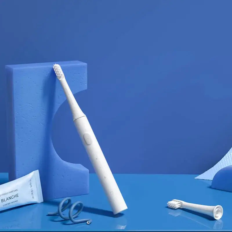 a toothbrush and toothbrush on a blue background
