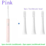 a toothbrush and a toothbrush with the words pink