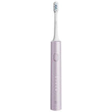 a white electric toothbrush with a purple handle