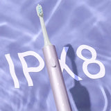 a toothbrush is in the water with the word pk8