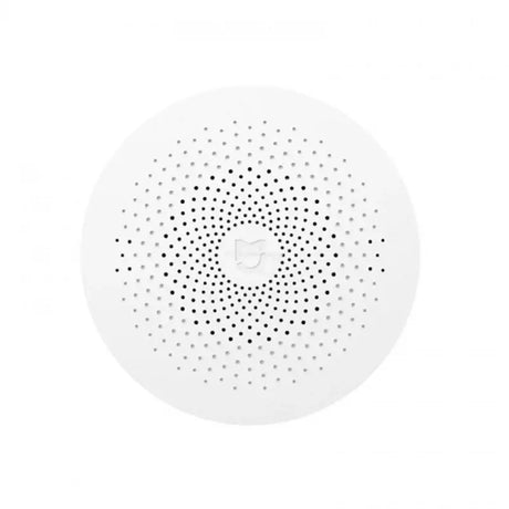 the white speaker with black dots on it