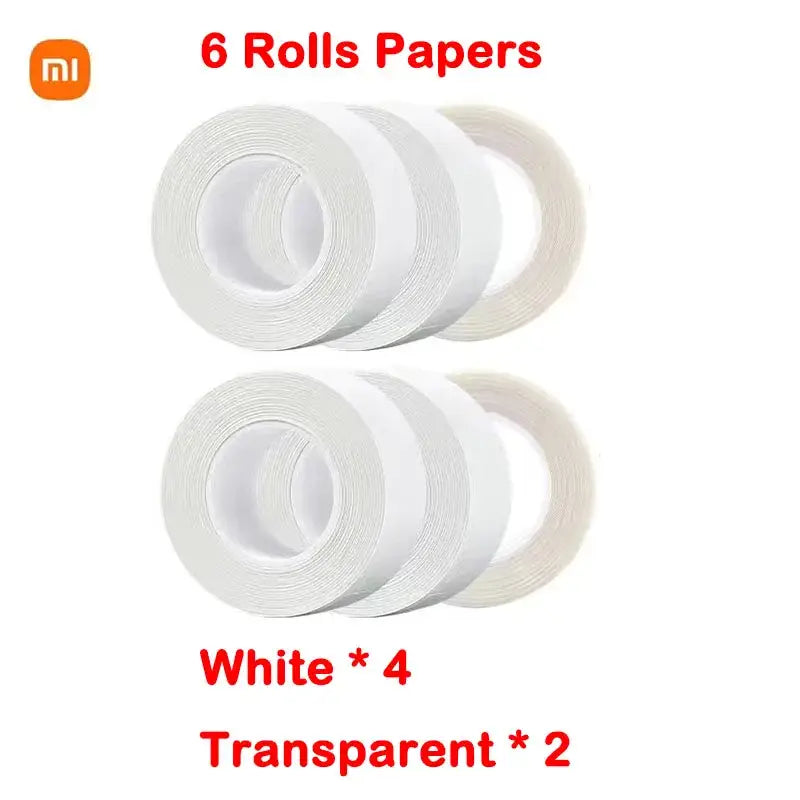 three rolls of white tape are stacked on top of each other