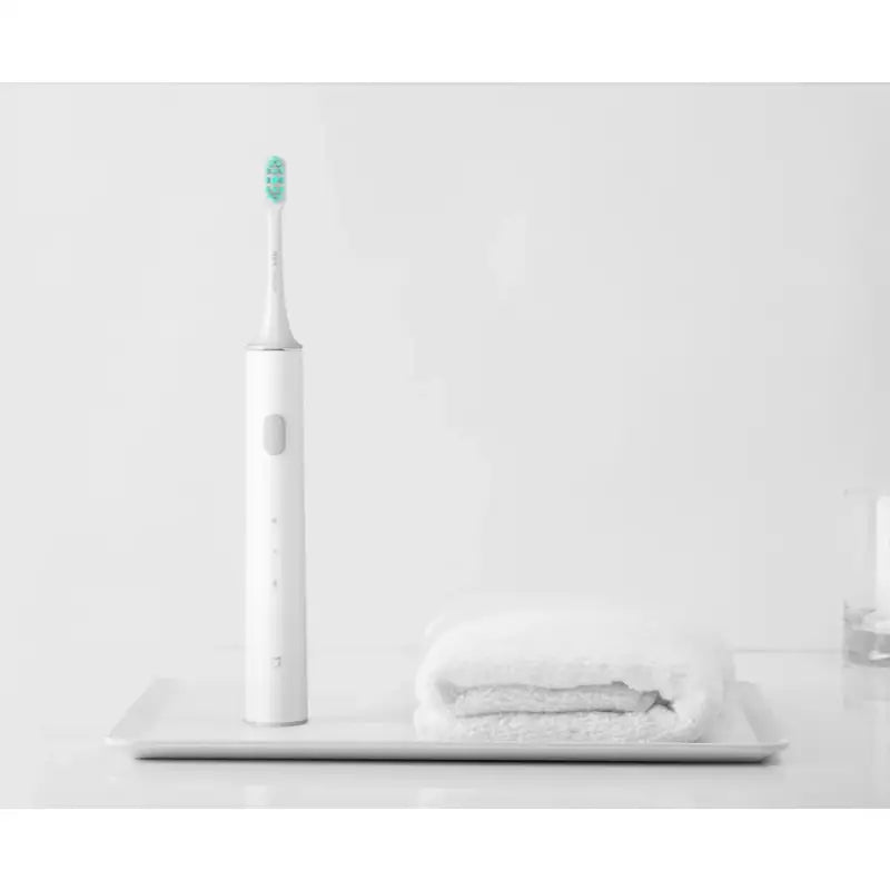 a toothbrush with a toothbrush on top