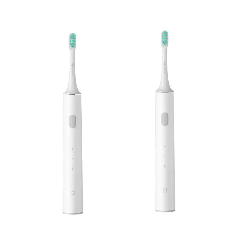 a white tooth with a green toothbrush