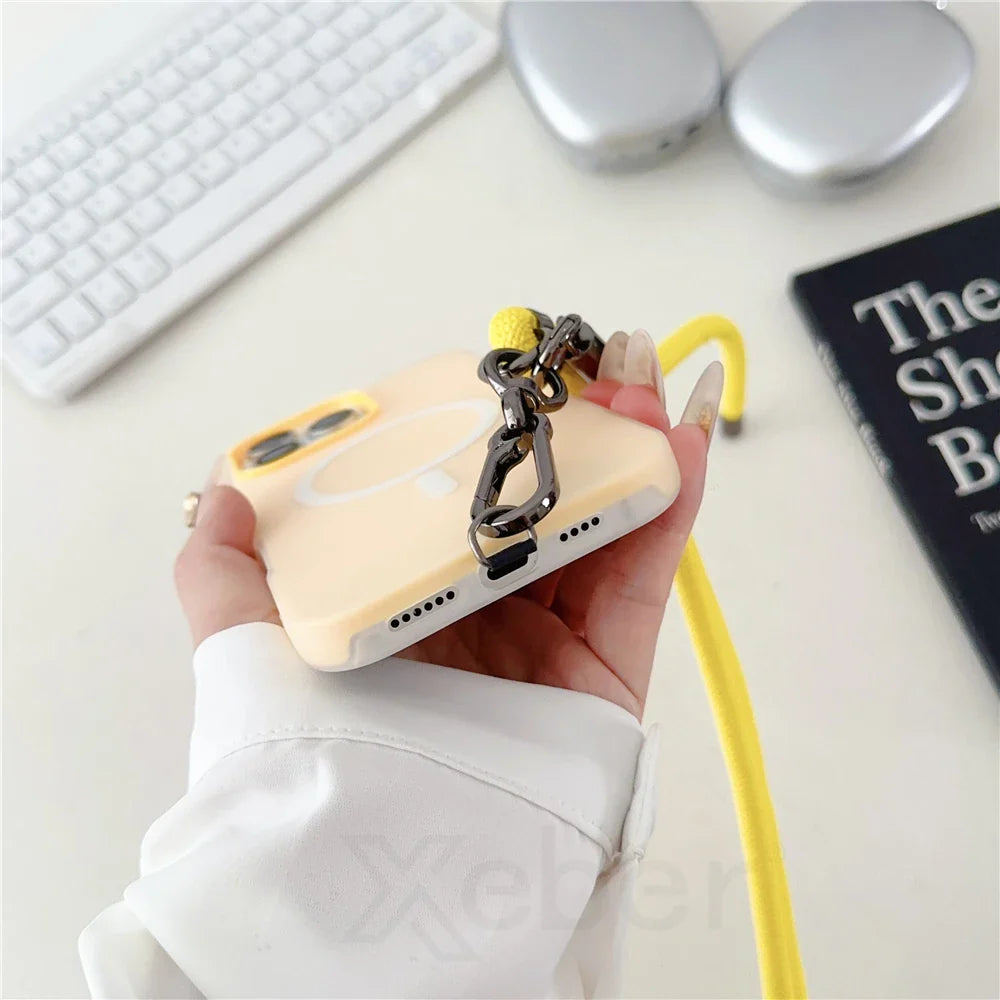 Yellow phone case with chain and strap.