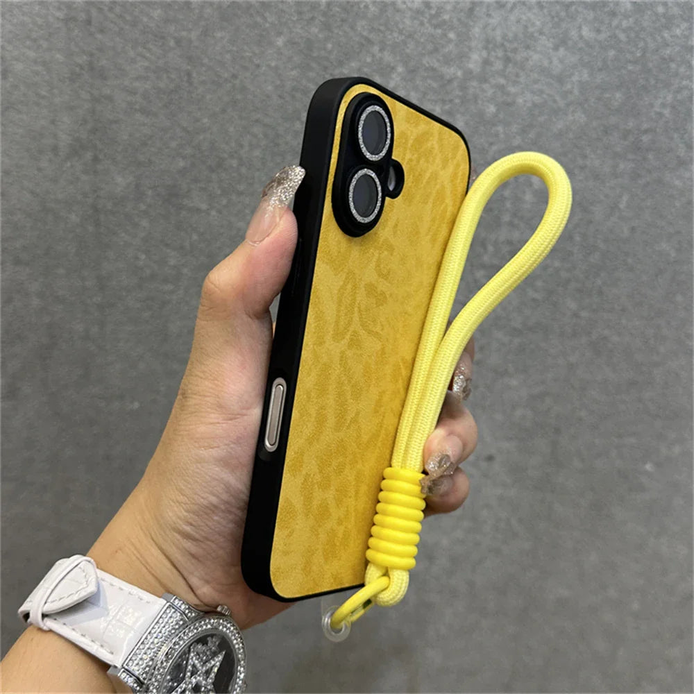 Yellow phone case with wrist strap.