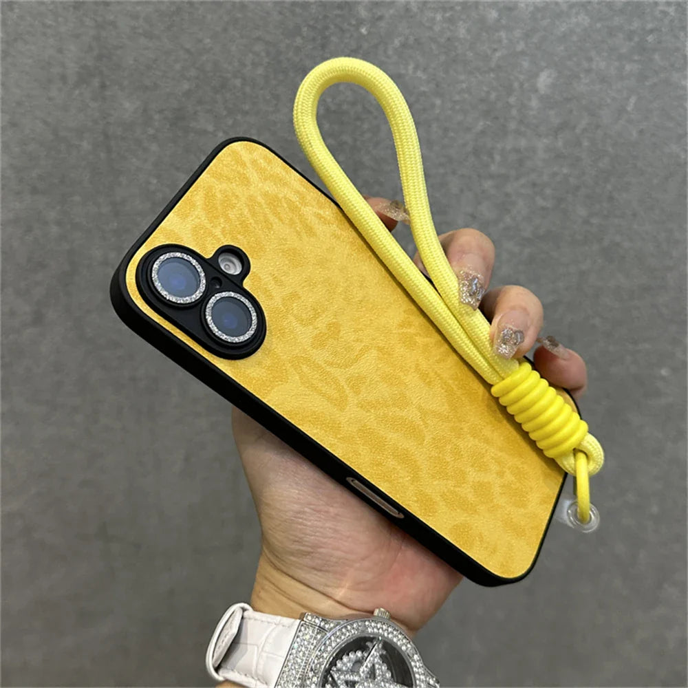 Yellow phone case with a wrist strap.