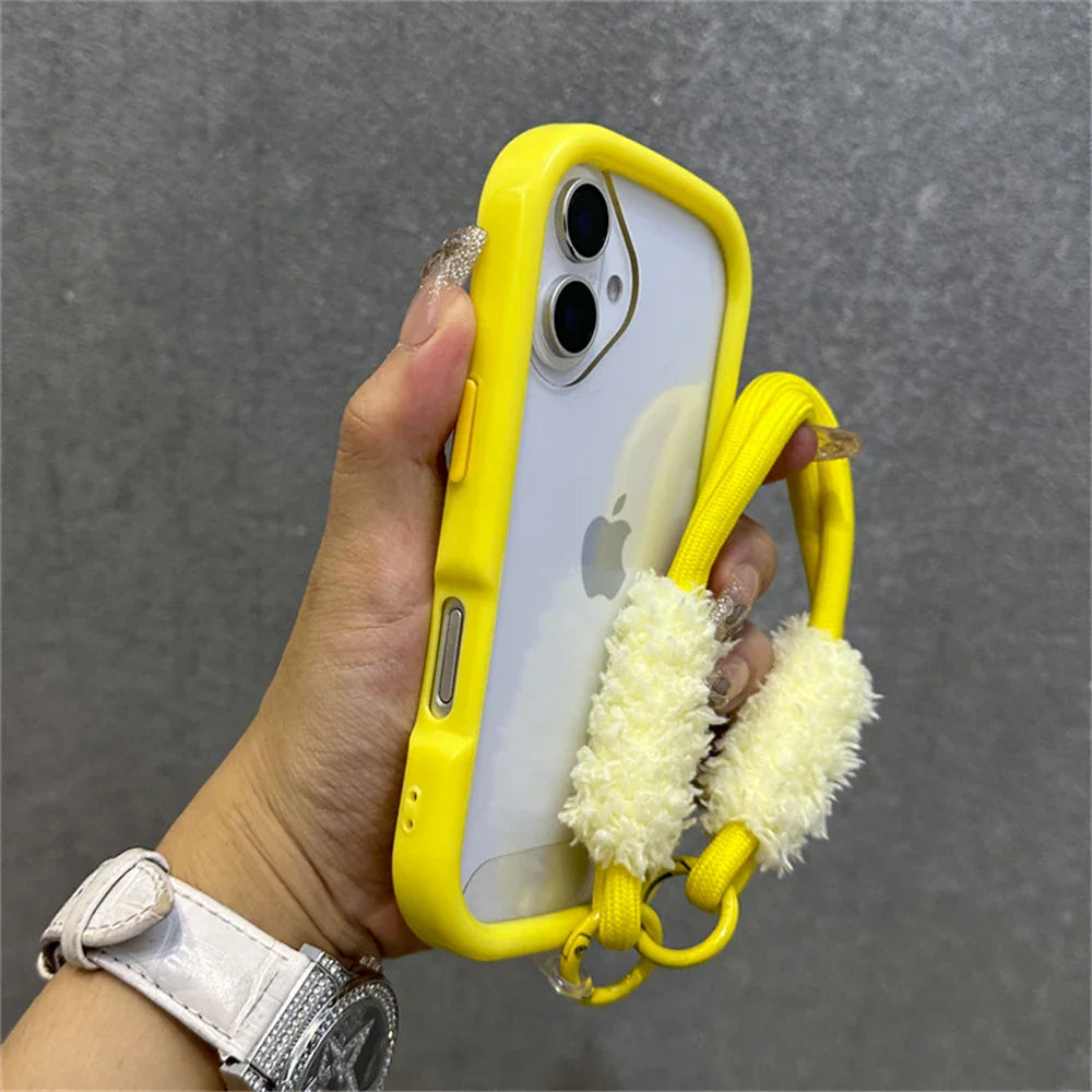 Yellow-trimmed phone case with fluffy wrist strap.