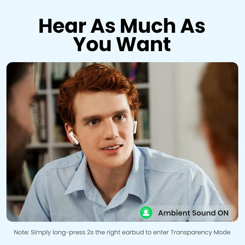 Young man with curly red hair wearing a light blue shirt, looking attentively at someone off-camera.