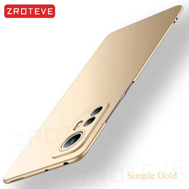 a close up of a gold iphone case with a white background