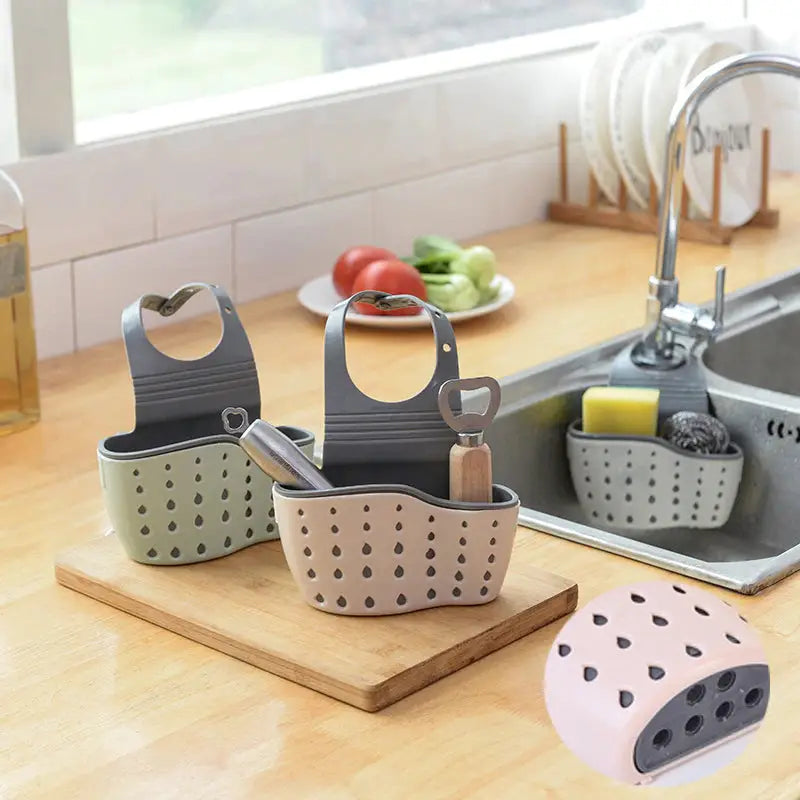 a kitchen sink with two different colored dishes