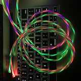 a computer keyboard with glowing neons on it