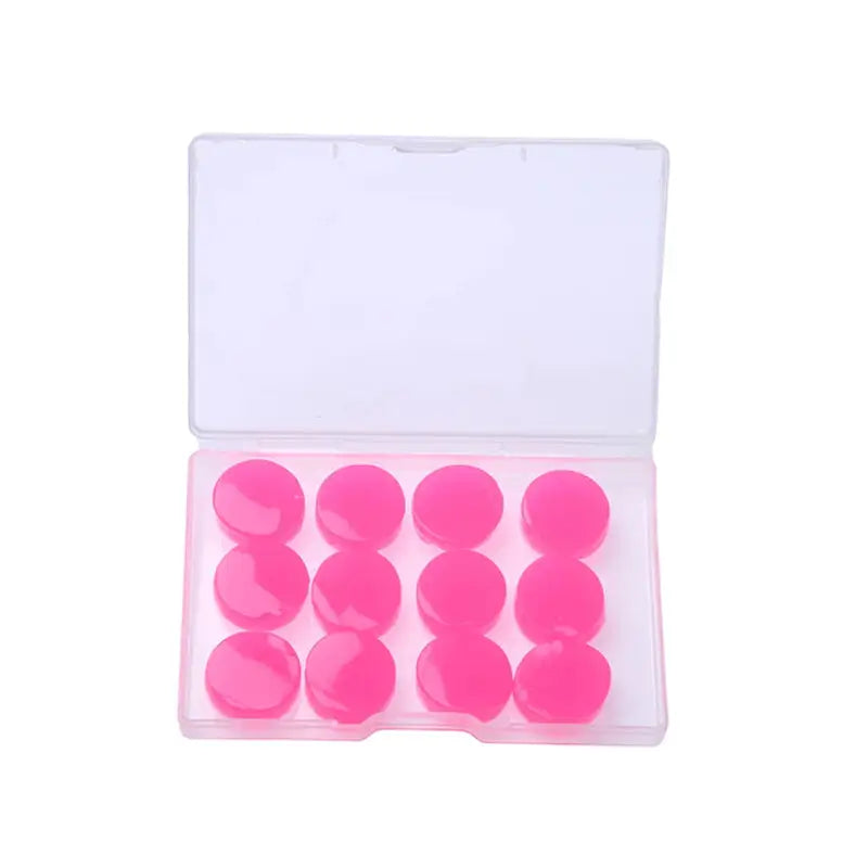 a pink plastic box with a small plastic button