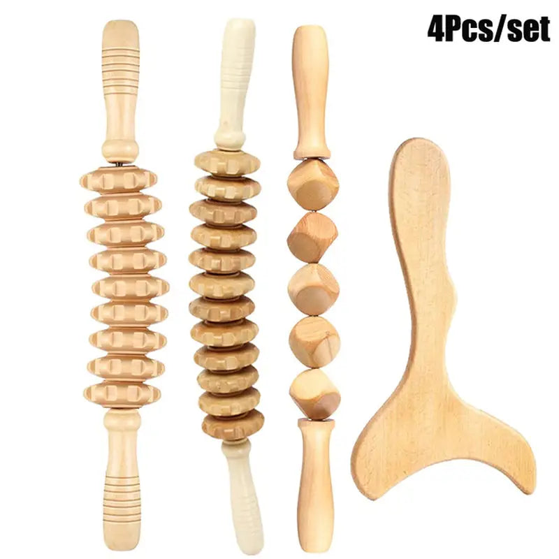 there are four wooden tools that are sitting on a white surface