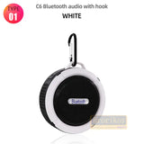 a white bluetooth speaker with hook on a white background