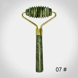 a gold and green jade stone razor