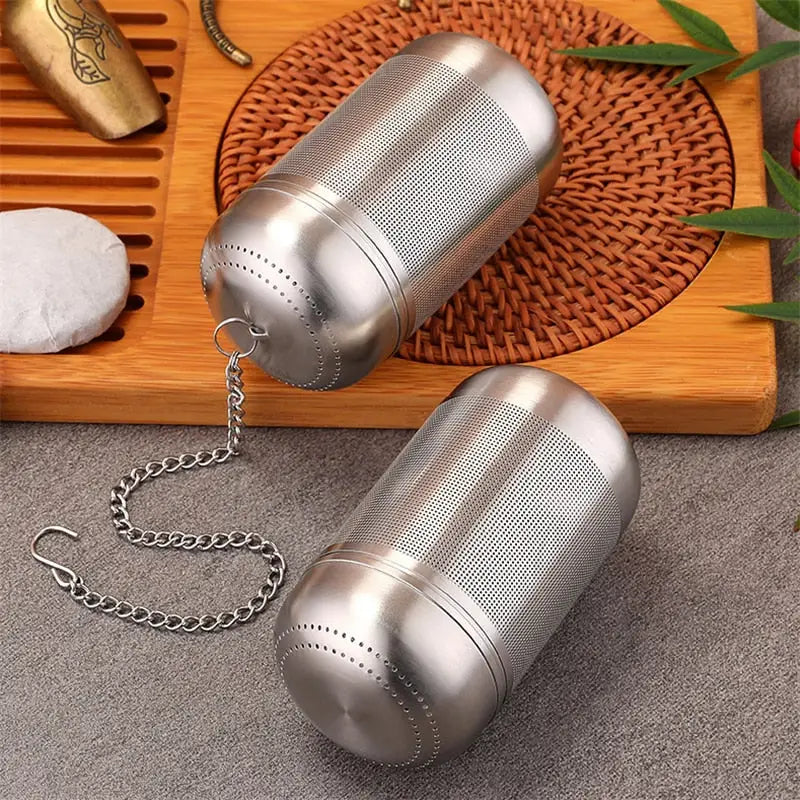 two stainless steel pepper shakers with chain