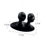 a pair of black plastic ear plugs