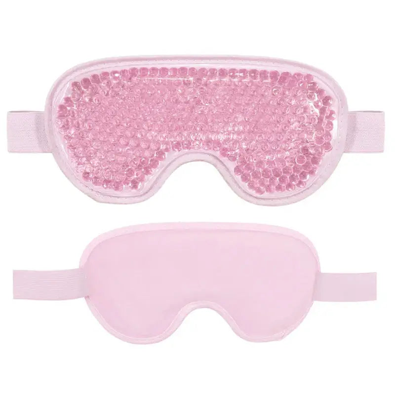 a close up of a pair of pink eye masks with sequins