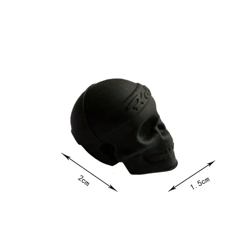 a black skull head with a white background